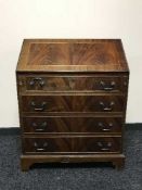An inlaid mahogany bureau