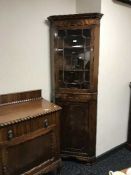 A mahogany corner cabinet