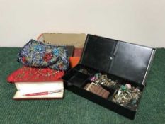 A box of costume jewellery, beaded purse,
