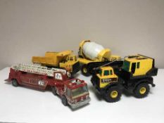 A collection of toy trucks, Tonka crane,