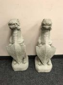 A pair of garden figures - gargoyles bearing shields