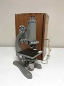 A 20th century microscope in mahogany box