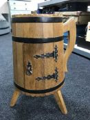 An oak barrel storage cupboard modelled as a flagon