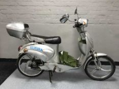 A Sakura scooter with key and charger
