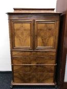 A continental mahogany secretaire cabinet