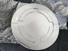 A contemporary unframed mirror