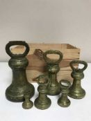 A set of six antique brass graduated weights