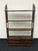 A Regency style wall rack fitted four drawers together with an inlaid table.