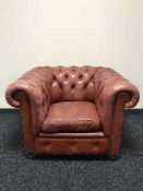 A burgandy leather Chesterfield club chair