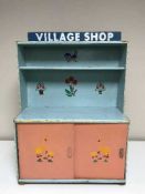 A mid 20th century wooden village shop