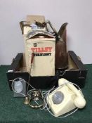 A box of two Tilly storm lights, telephone,