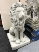 A garden figure - seated lion