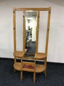 An Edwardian mirror backed hall stand