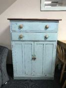 A painted pine cabinet fitted two drawers