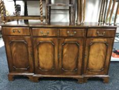 A mahogany break-fronted sideboard