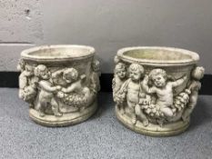 A pair of garden cherub planters