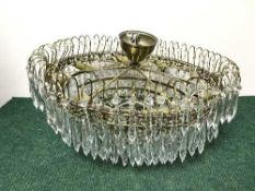 A large mid 20th century light fitting with glass drops