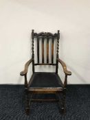 A carved oak armchair