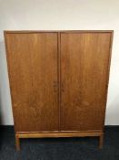 A mid 20th century teak office cabinet