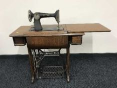 A Singer oak treadle sewing machine