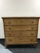 An oak four drawer chest