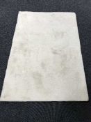 A cream wool rug