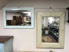 A contemporary mirror and a glass framed mirror