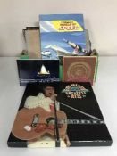 A box of LP records and Embassy cigarette cards and albums