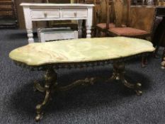 A gilt metal marble topped coffee table