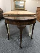 A mahogany d-shaped TOT card table