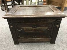 An antique oak coal receiver with liner