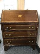 A Victorian inlaid mahogany bureau