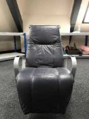 A blue leather metal framed swivel armchair