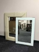 A cream leather cushion mirror and a un-framed all glass mirror