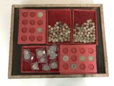 A counter top display cabinet and a late 19th century half dollars and silver threpenny pieces