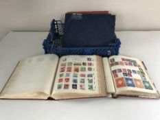 Five assorted 20th century stamp albums and stamps