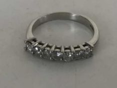 A platinum diamond half eternity ring