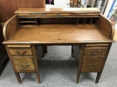 A mahogany roll top desk