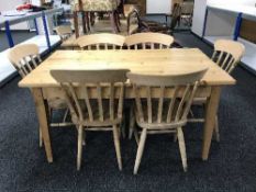A pine refectory table and six chairs