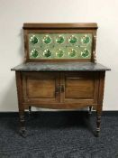 A Victorian tiled backed wash stand