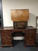 A mahogany twin pedestal dressing table and a oak storage table