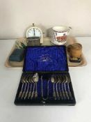 A tray of set of twelve cased plated table spoons and tongs, Lloyds Bank money box,