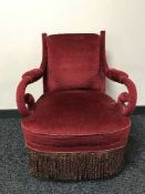 An antique bedroom chair in red dralon
