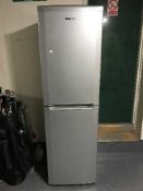 A silver Beko upright fridge freezer