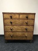 A Victorian oak five drawer chest