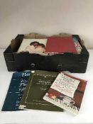 Two boxes of music books and a box of books