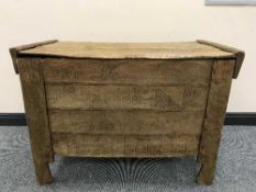 A rustic pine hay bin