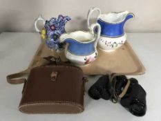 A tray of cased German Hartmann binoculars in case and three late 19th century pottery jugs