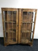 A walnut double door display cabinet