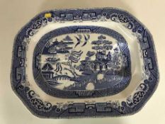 A 19th century blue and white willow pattern meat plate
